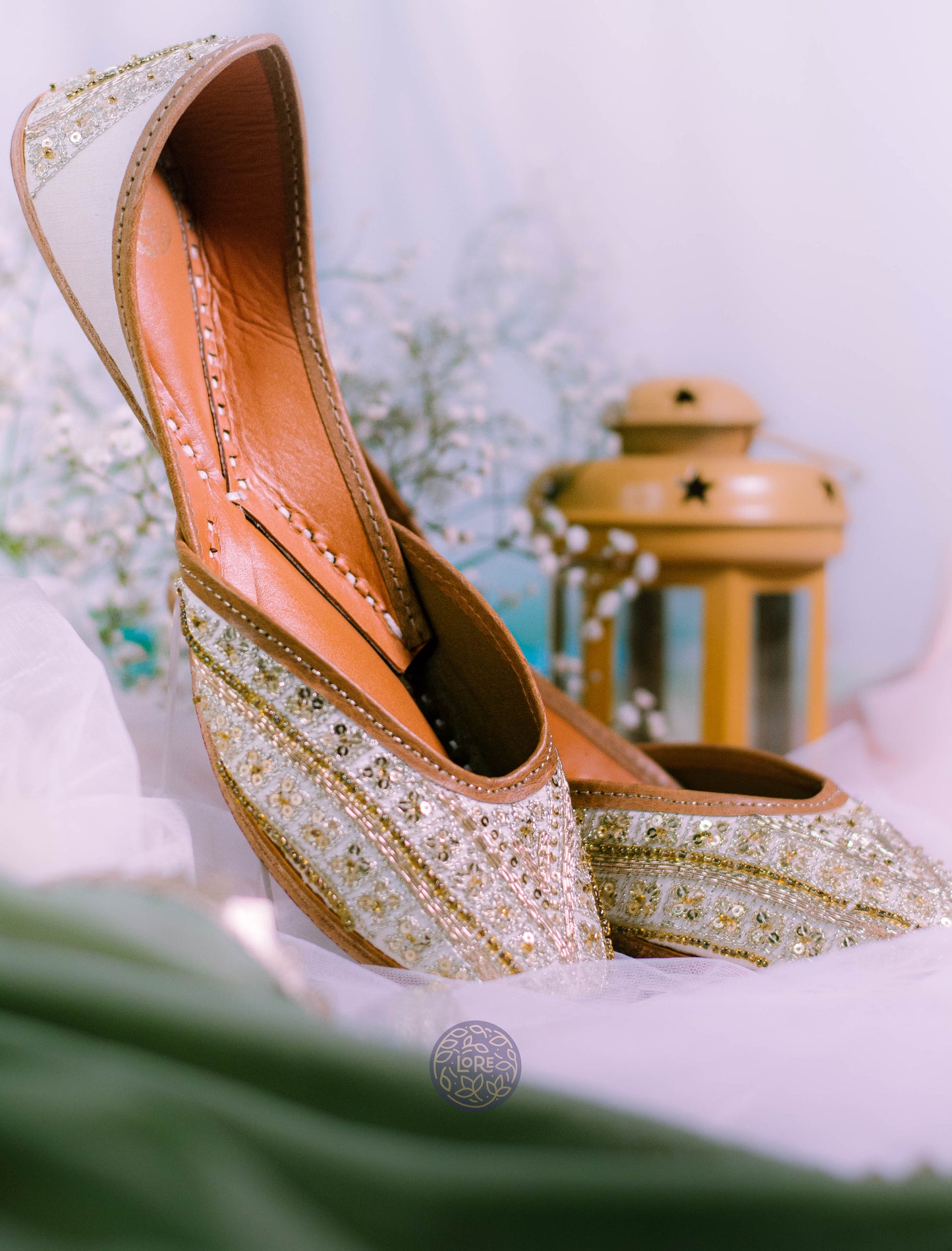 White hand-worked bridal juttis